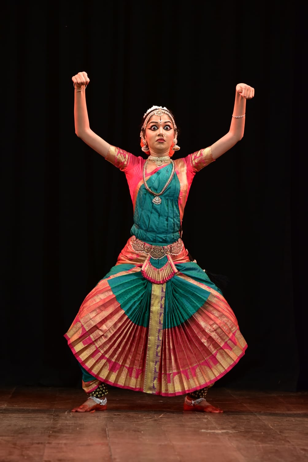 Bharatanatyam posture with raised arms